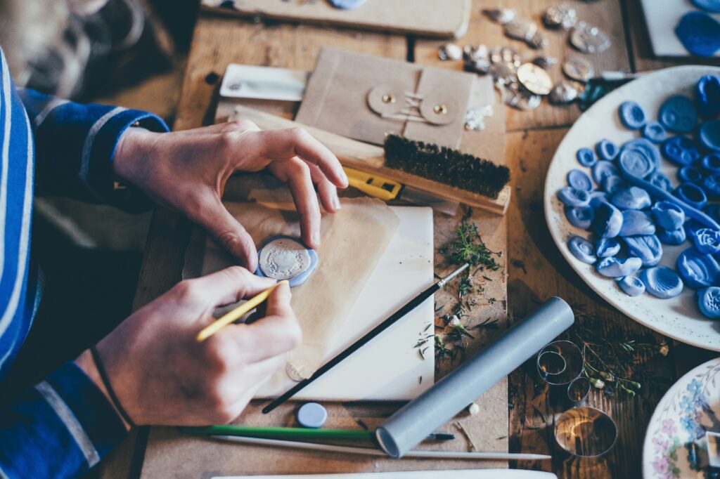 Person working with clay