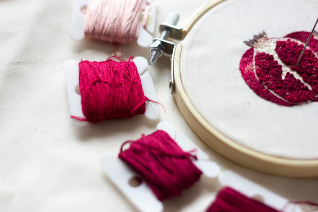Handmade embroidery of a pomegranate