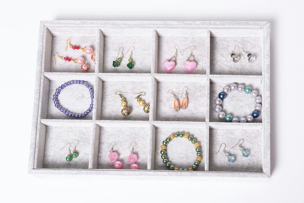 Handmade jewelry (earrings and bracelets) on a tray