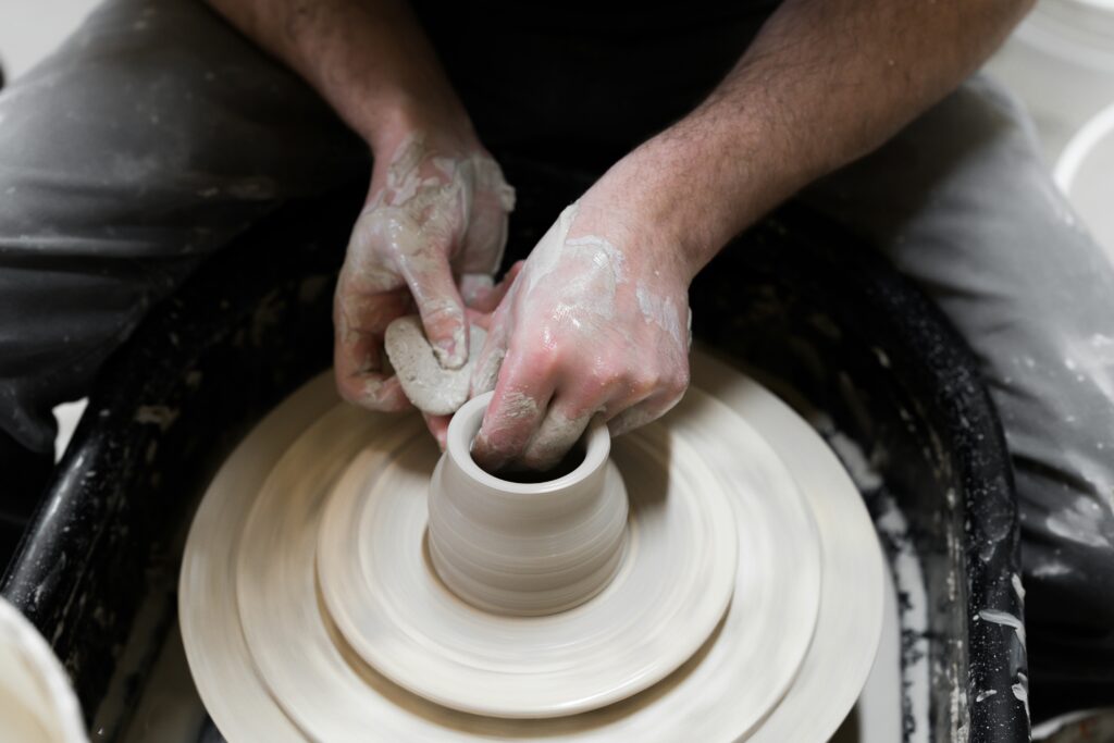 Local artisan and his pottery wheel